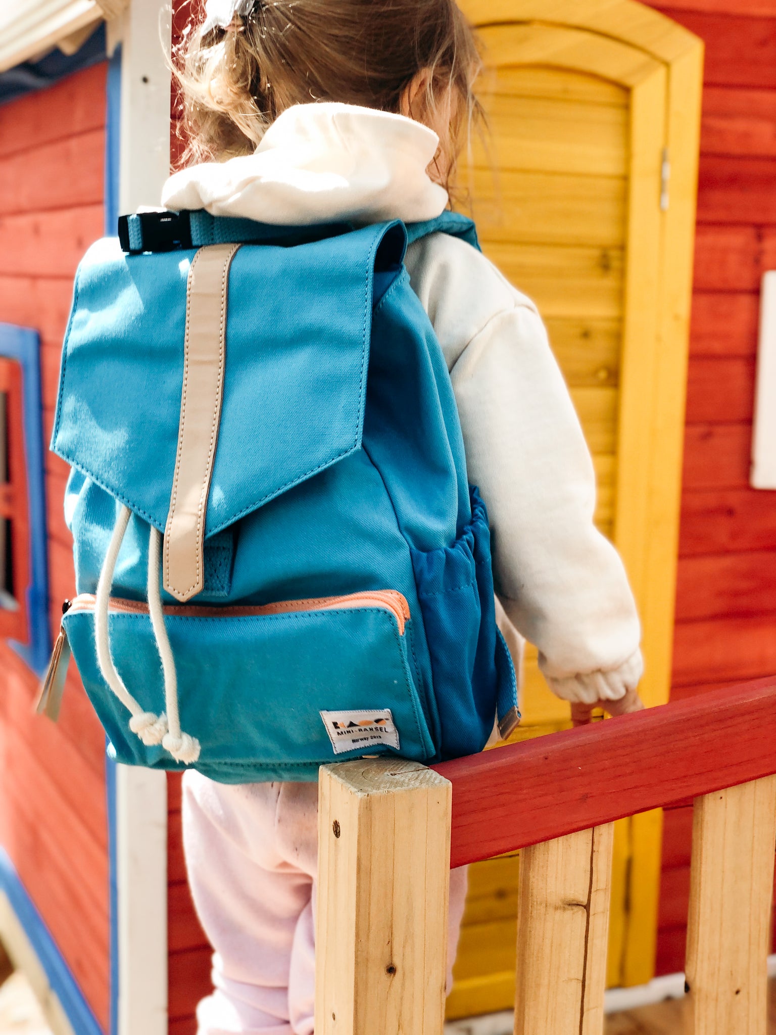 images of a mini blue backpack CONVERTIBLE TOTE Though small Mini Backpack